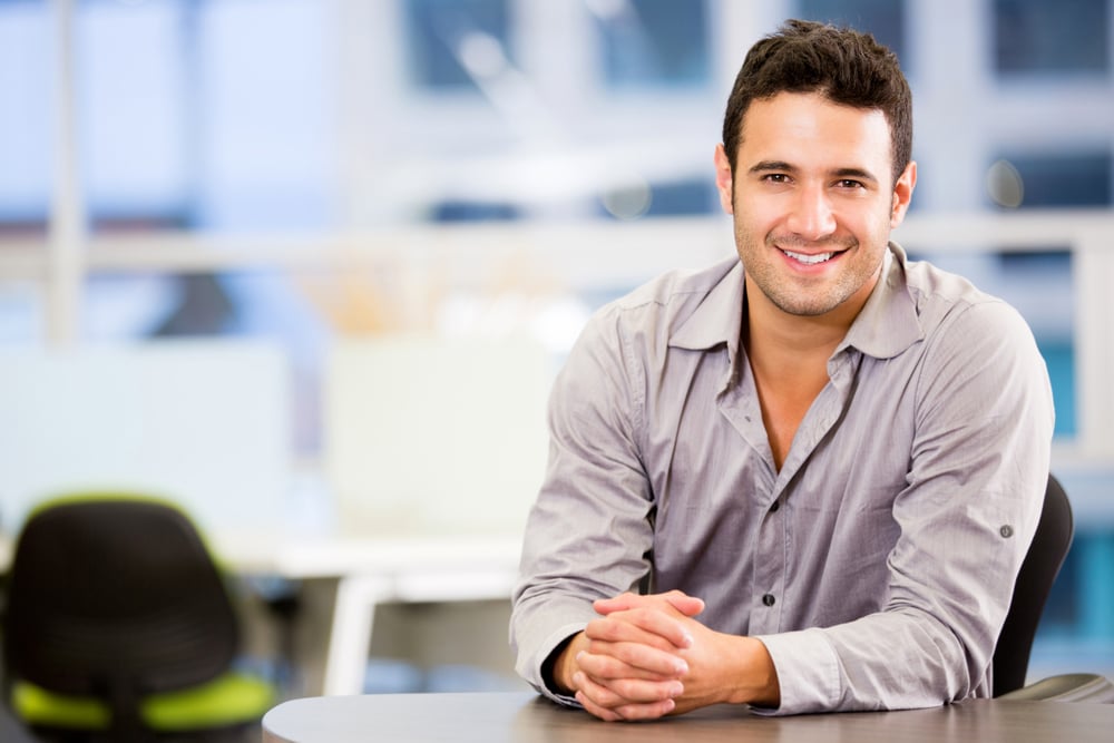 Handsome business man smiling at the office